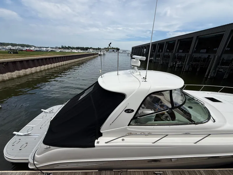 Slide: The Image of 2000 Sea Ray 460 Sundancer yacht docked at marina under cloudy sky. - 41