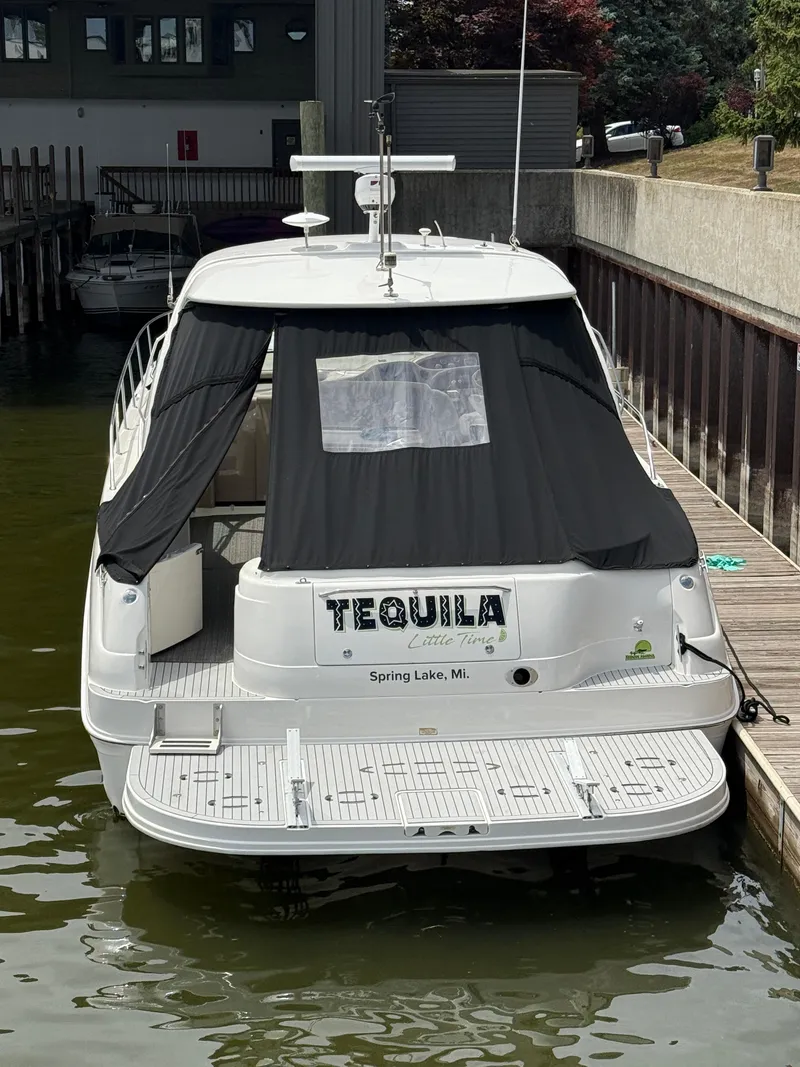 Slide: The Image of 2000 Sea Ray 460 Sundancer docked, named "Tequila," in Spring Lake, Michigan. - 5