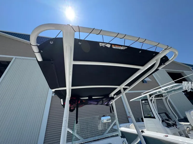 Slide: The Image of 2020 Wellcraft 182 Fisherman boat with T-top under bright sun. - 10