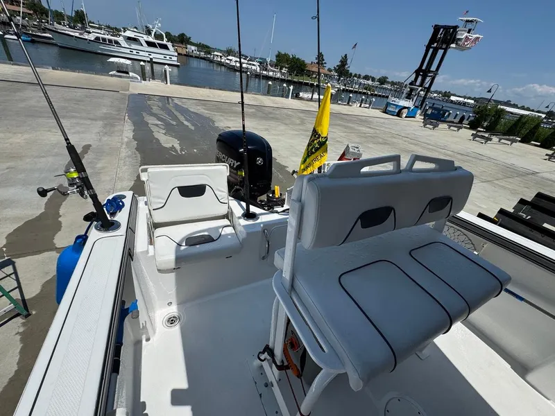 Slide: The Image of 2020 Wellcraft 182 Fisherman boat at marina with fishing gear and Mercury engine. - 13