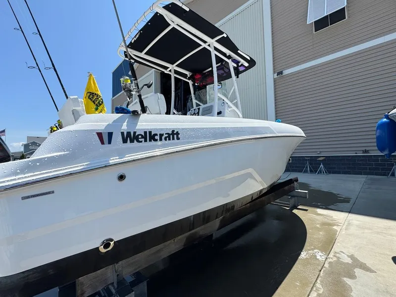 Slide: The Image of 2020 Wellcraft 182 Fisherman boat on trailer, side view, outdoors. - 4