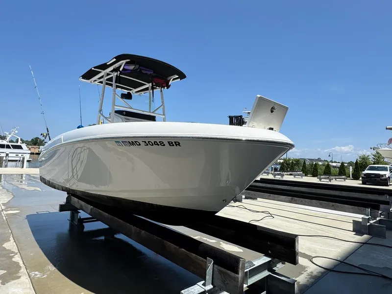 Slide: The Image of 2020 Wellcraft 182 Fisherman boat on trailer under clear blue sky. - 5