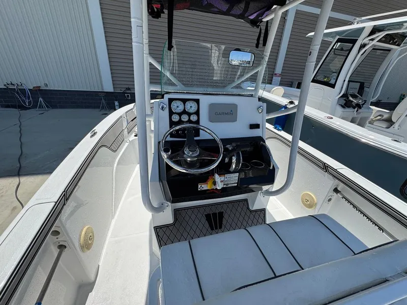 Slide: The Image of 2020 Wellcraft 182 Fisherman boat interior with steering console and Garmin navigation system. - 9