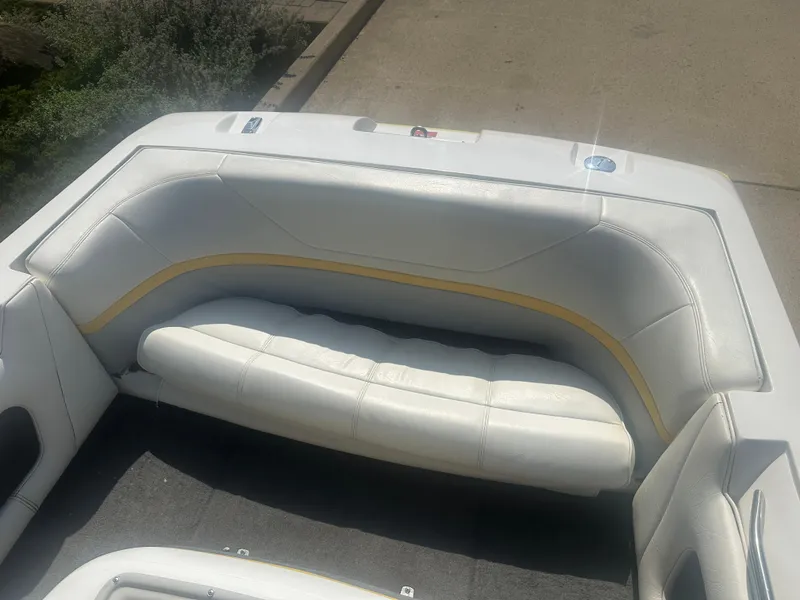 Slide: The Image of 1990 MasterCraft Prostar190 boat interior with white and yellow seating. - 4