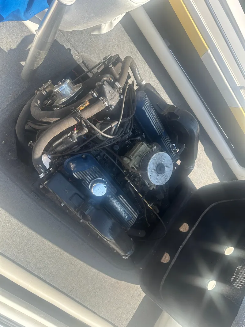 Slide: The Image of 1990 MasterCraft Prostar190 engine compartment with visible components and wiring. - 7