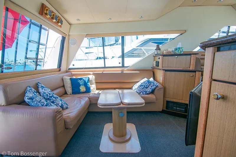 Slide: The Image of Luxurious interior of 2002 Bayliner 3988 Command Bridge Motoryacht with plush seating and nautical decor. - 11