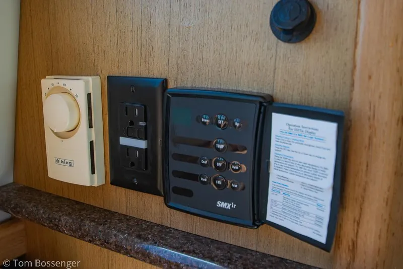 Slide: The Image of Control panel and thermostat on 2002 Bayliner 3988 Command Bridge Motoryacht interior. - 13