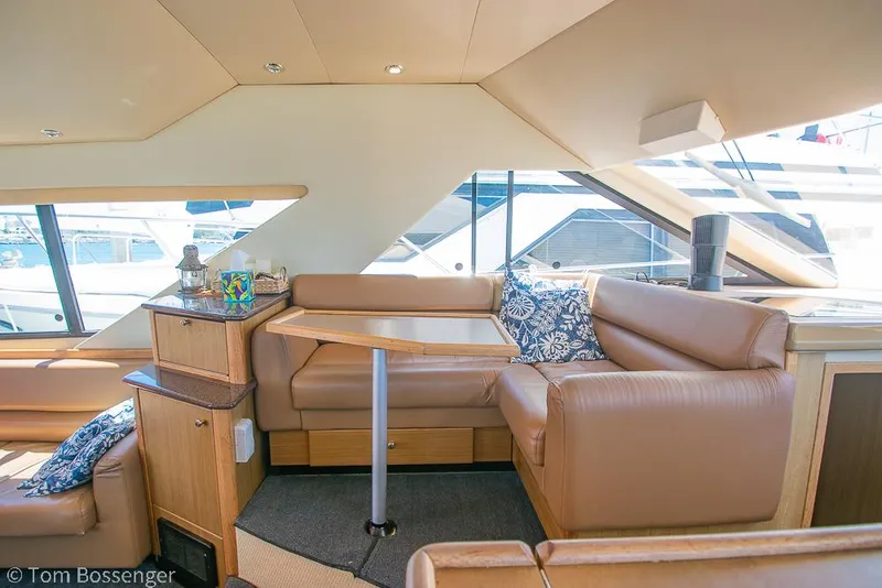 Slide: The Image of Luxurious interior of 2002 Bayliner 3988 Command Bridge Motoryacht with leather seating and nautical decor. - 18