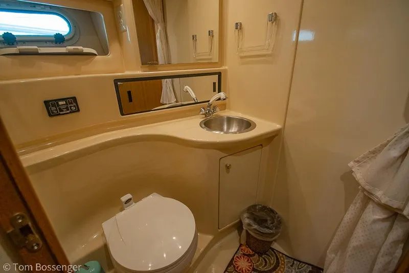 Slide: The Image of Bathroom interior of 2002 Bayliner 3988 Command Bridge Motoryacht, featuring sink and toilet. - 30