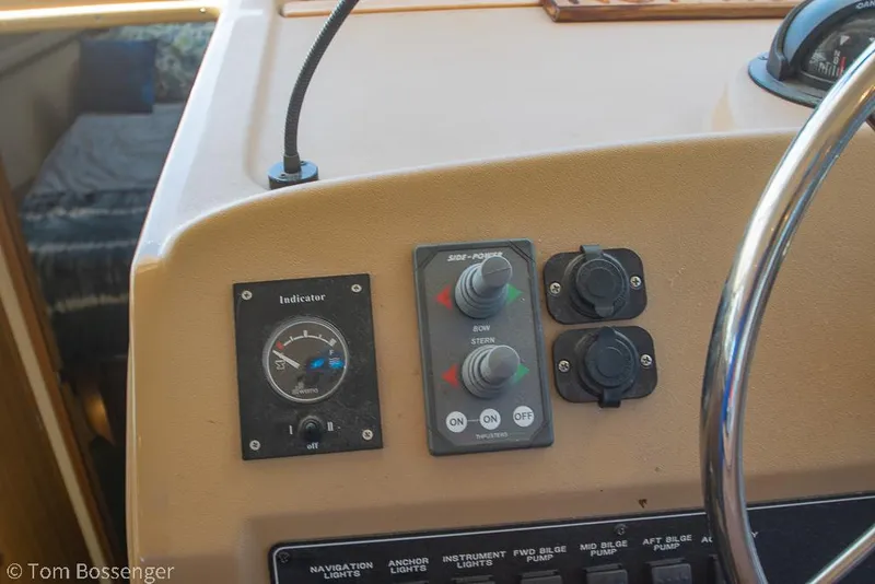 Slide: The Image of Control panel of 2002 Bayliner 3988 Command Bridge Motoryacht with steering wheel and indicators. - 33