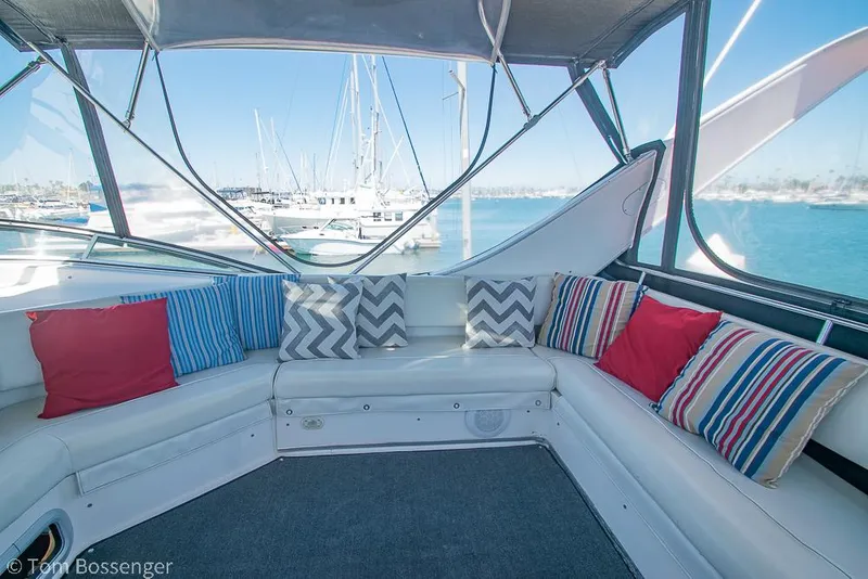Slide: The Image of 2002 Bayliner 3988 Command Bridge Motoryacht interior with colorful cushions and marina view. - 41