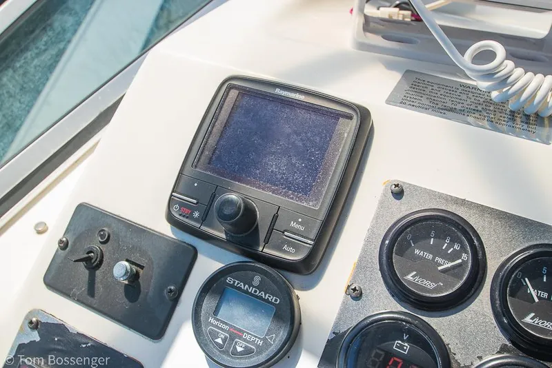 Slide: The Image of Control panel of 2002 Bayliner 3988 Command Bridge Motoryacht with gauges and navigation equipment. - 45