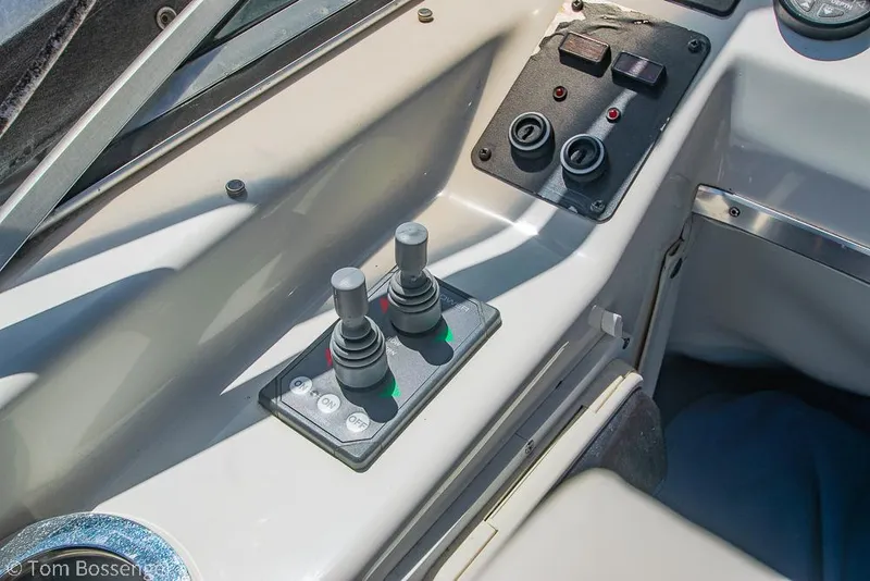 Slide: The Image of Control panel of 2002 Bayliner 3988 Command Bridge Motoryacht with joysticks and switches. - 47