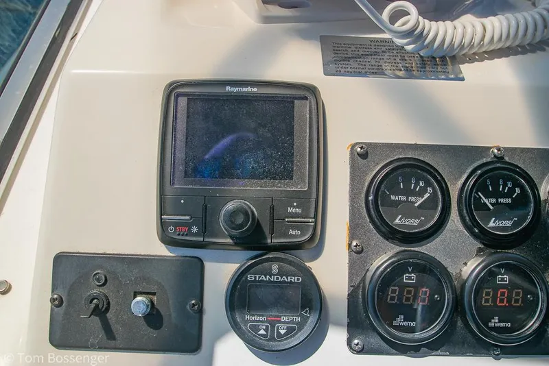 Slide: The Image of Control panel of 2002 Bayliner 3988 Command Bridge Motoryacht with gauges and Raymarine display. - 48