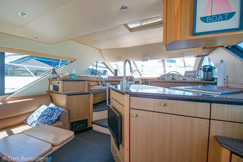Slide: The Image of Luxurious interior of 2002 Bayliner 3988 Command Bridge Motoryacht with modern kitchen and seating area. - 9