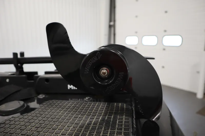 Slide: The Image of Close-up of a 2012 Tracker 190 TX Pro Team boat component in a garage. - 14