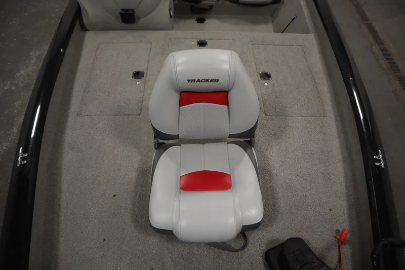 Slide: The Image of 2012 Tracker 190 TX Pro Team boat interior with dual seats and carpeted flooring. - 17