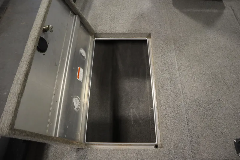 Slide: The Image of Open storage compartment in 2012 Tracker 190 TX Pro Team boat. - 20