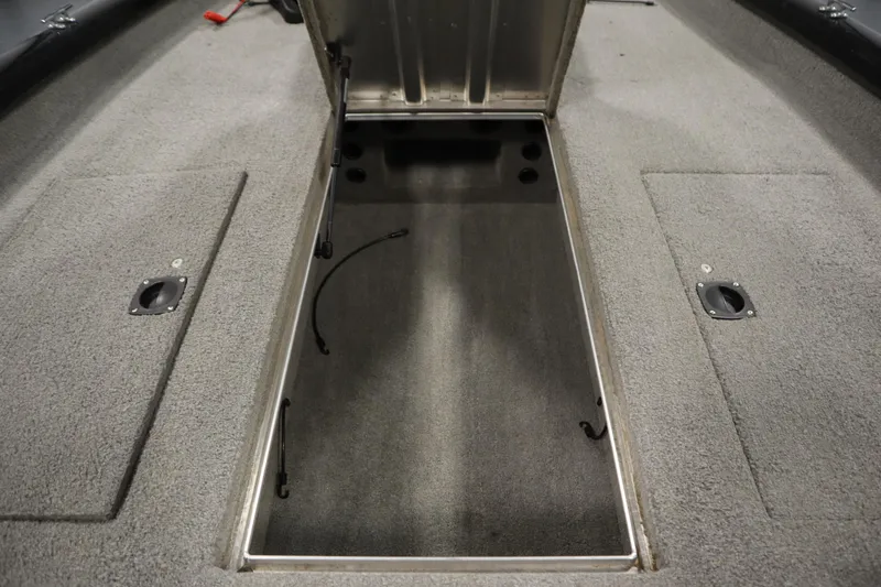 Slide: The Image of Open storage compartment in a 2012 Tracker 190 TX Pro Team boat. - 21