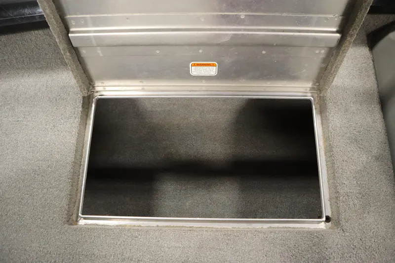 Slide: The Image of Open storage compartment in 2012 Tracker 190 TX Pro Team boat. - 22