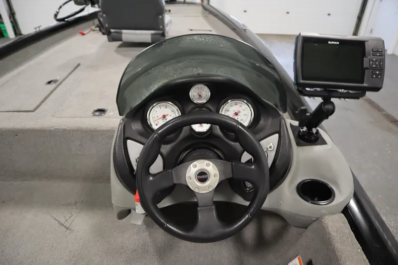 Slide: The Image of 2012 Tracker 190 TX Pro Team boat dashboard with steering wheel and Garmin GPS. - 24