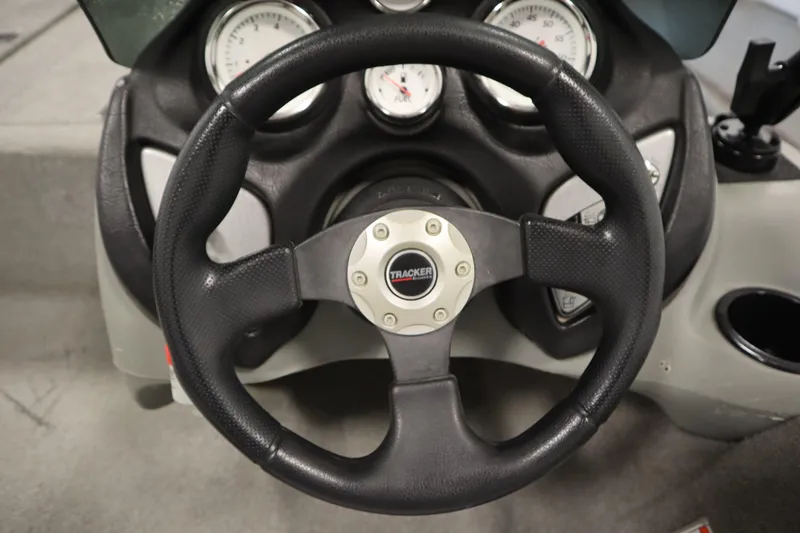 Slide: The Image of Steering wheel of 2012 Tracker 190 TX Pro Team boat with dashboard gauges. - 25