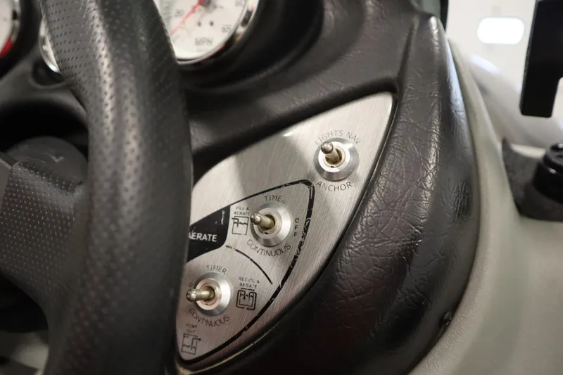 Slide: The Image of 2012 Tracker 190 TX Pro Team dashboard with switches and steering wheel detail. - 29