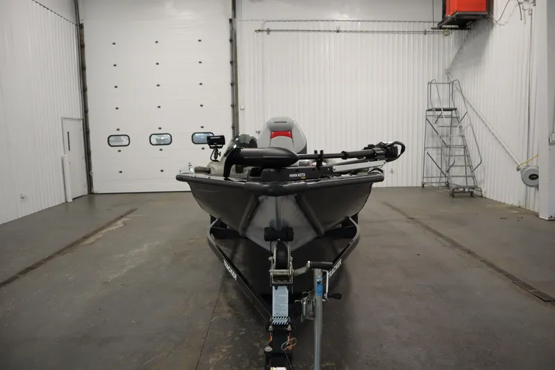 Slide: The Image of 2012 Tracker 190 TX Pro Team boat in a spacious indoor garage. - 3