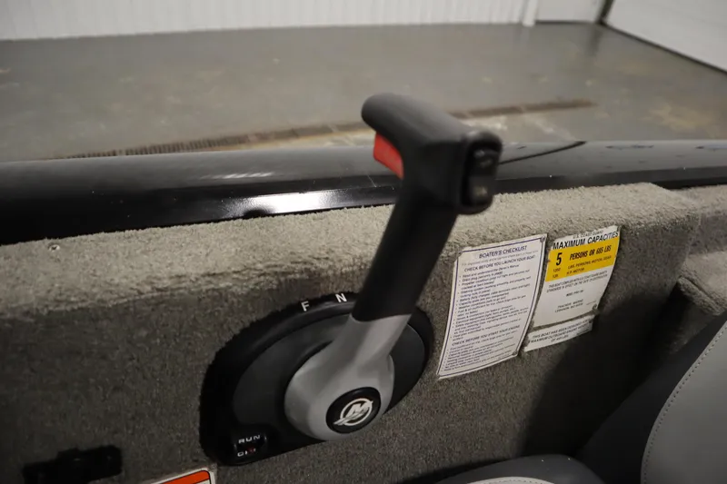 Slide: The Image of Throttle control lever on a 2012 Tracker 190 TX Pro Team boat interior. - 31