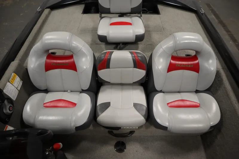 Slide: The Image of 2012 Tracker 190 TX Pro Team boat seats with red and white upholstery. - 33