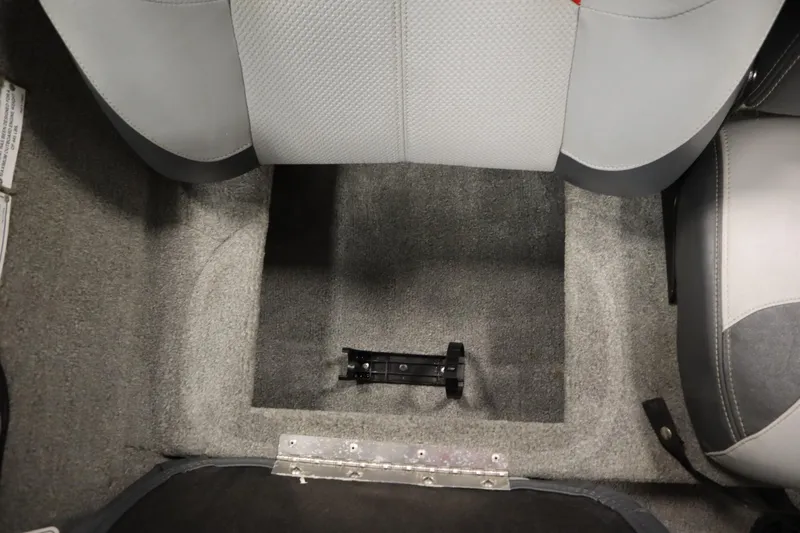 Slide: The Image of Interior view of a 2012 Tracker 190 TX Pro Team boat, showing seating and carpeted flooring. - 36