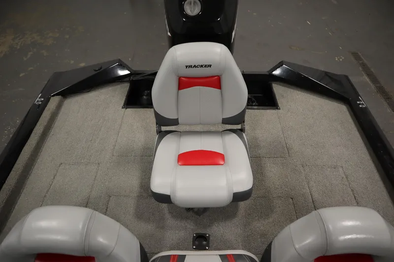 Slide: The Image of 2012 Tracker 190 TX Pro Team boat interior with gray and red seating. - 38