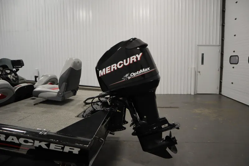 Slide: The Image of 2012 Tracker 190 TX Pro Team boat with Mercury OptiMax engine in a garage. - 43