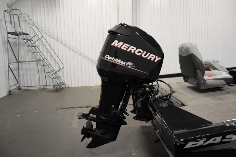 Slide: The Image of 2012 Tracker 190 TX Pro Team with Mercury OptiMax engine in a garage setting. - 44