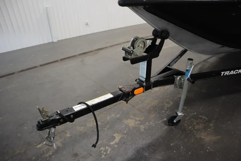 Slide: The Image of Trailer hitch of a 2012 Tracker 190 TX Pro Team boat in a garage. - 47