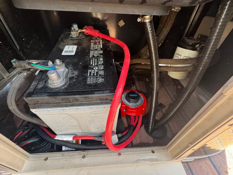 Slide: The Image of Battery compartment of 2016 Avalon Catalina 2385 Rear Fish boat with wiring and components. - 14