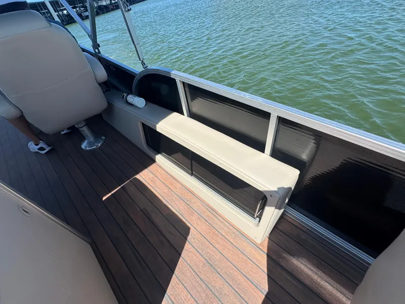 Slide: The Image of 2016 Avalon Catalina 2385 Rear Fish boat interior with seating and water view. - 16