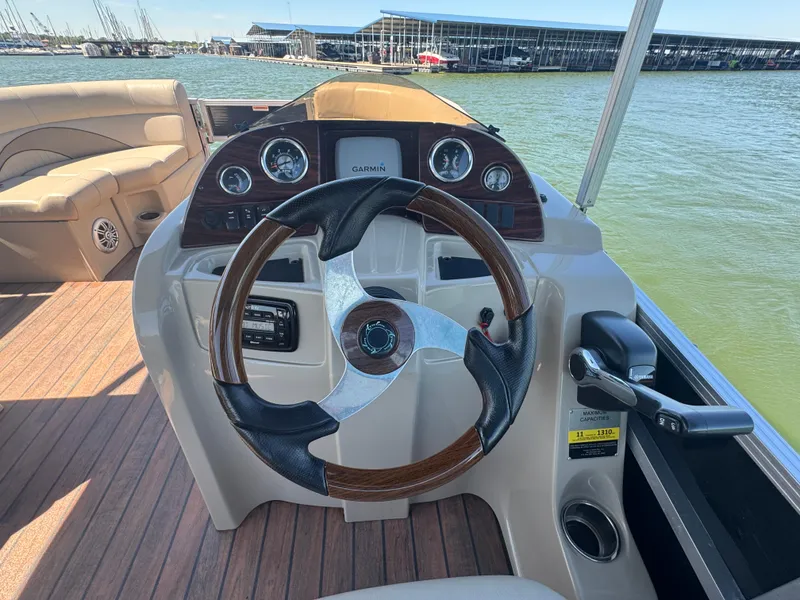 Slide: The Image of Steering console of 2016 Avalon Catalina 2385 Rear Fish boat with Garmin navigation. - 20