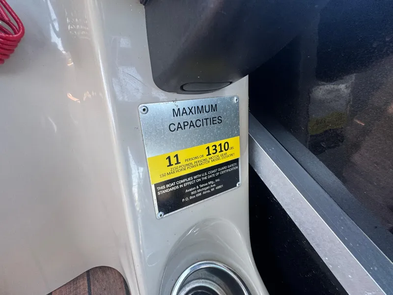 Slide: The Image of Capacity plate on 2016 Avalon Catalina 2385 Rear Fish, showing maximum 11 persons or 1310 lbs. - 23