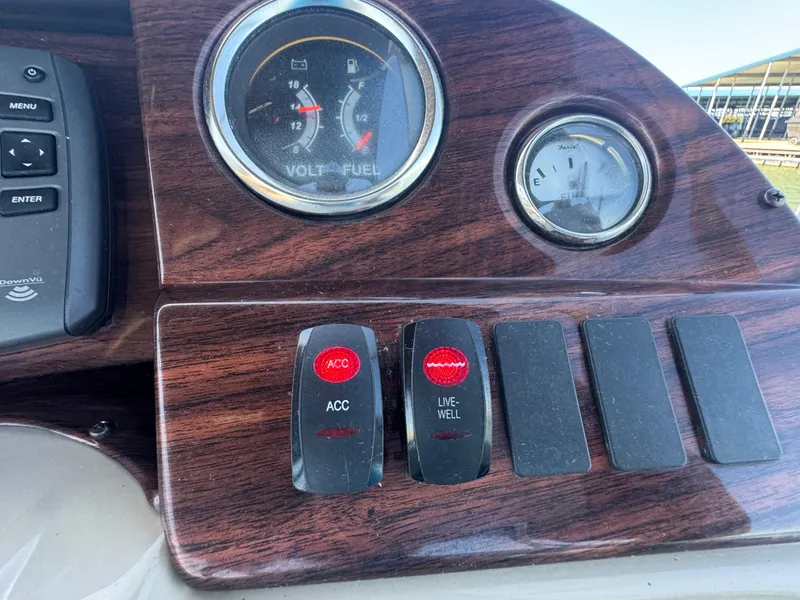 Slide: The Image of Control panel of 2016 Avalon Catalina 2385 Rear Fish boat with gauges and switches. - 26