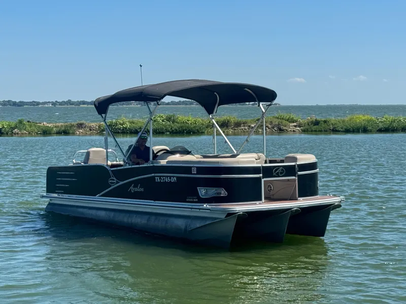 Slide: The Image of 2016 Avalon Catalina 2385 Rear Fish pontoon boat on a sunny lake. - 4