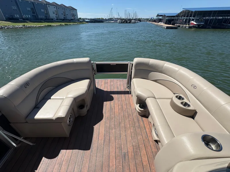 Slide: The Image of 2016 Avalon Catalina 2385 Rear Fish pontoon boat with spacious seating on a sunny day. - 7