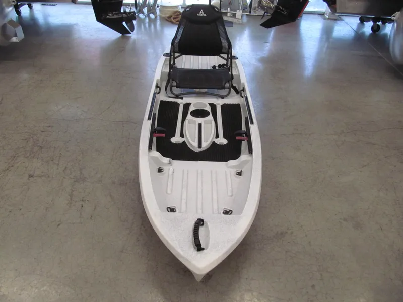 Slide: The Image of 2021 Ascend 10T Sit-On kayak in white-black, displayed indoors. - 2
