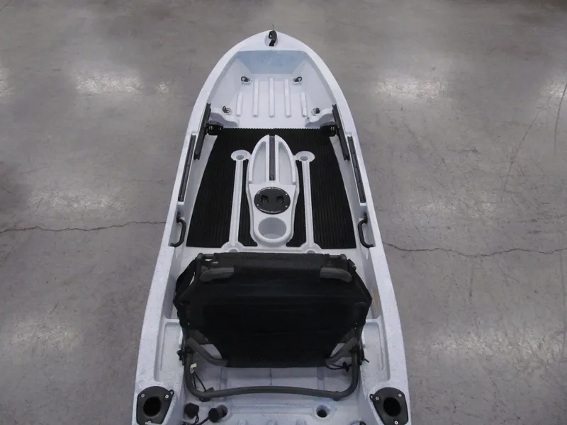 Slide: The Image of 2021 Ascend 10T Sit-On kayak, white-black, top view, featuring seat and storage areas. - 4