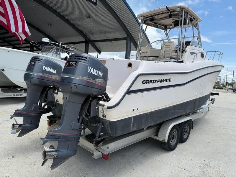 Slide: The Image of 1997 Grady-White F-26 Tigercat boat with twin Yamaha outboard engines on a trailer. - 7