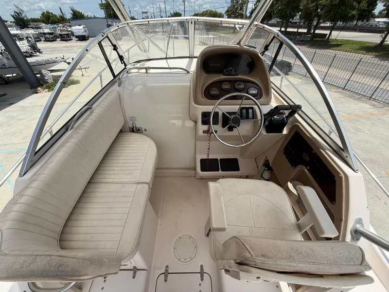 Slide: The Image of 1997 Grady-White F-26 Tigercat boat interior with steering wheel and seating. - 9