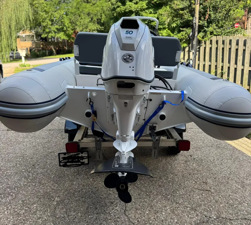 Slide: The Image of 2023 Highfield Classic 420 boat with outboard motor on a trailer. - 3