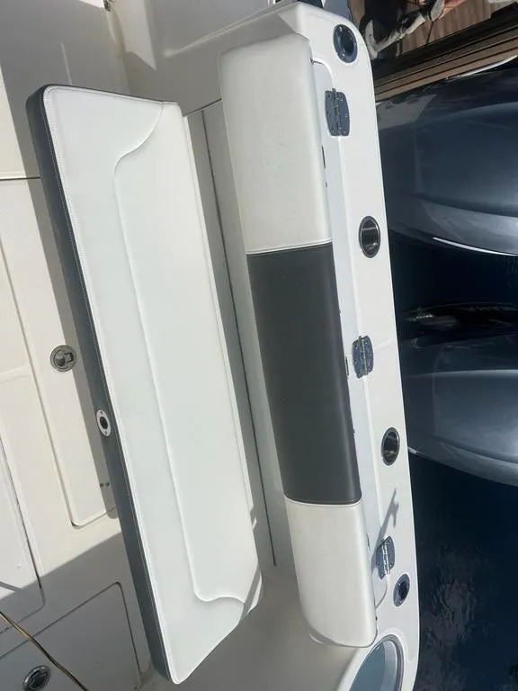 Slide: The Image of 2018 Robalo R302 Center Console boat seating and rod holders. - 8