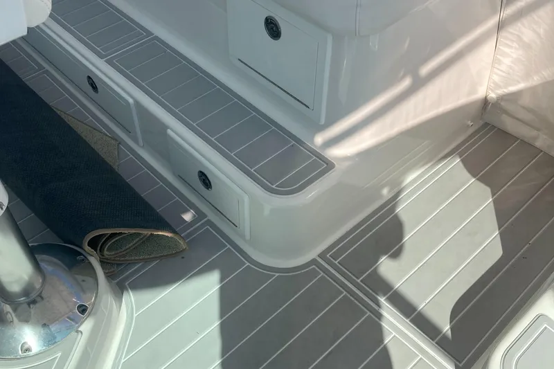 Slide: The Image of 2018 Albemarle 36 Express boat interior with rolled carpet and storage compartments. - 21