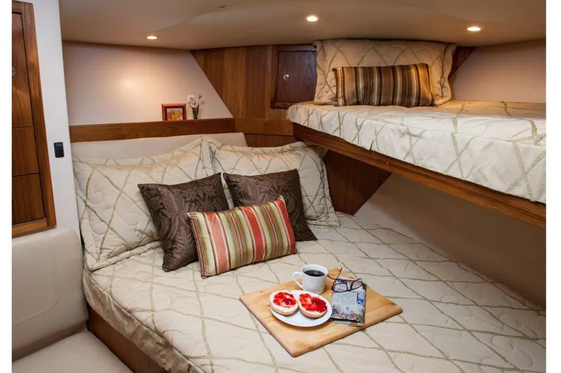Slide: The Image of Manufacturer Provided Image: Cozy cabin interior of 2018 Albemarle 36 Express with double bed and bunk. - 27